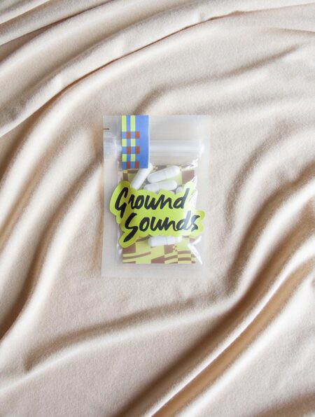 A ten pack of Stevies wonder pills laying on a cream background