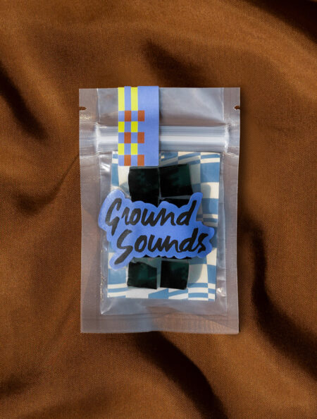 Blue raspberry gummies in a Ground Sounds labeled package
