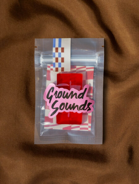 Red strawberry gummies in a Ground Sounds labeled package